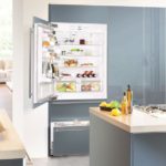 Холодильник в интерьере кухни встроенный в серый шкаф